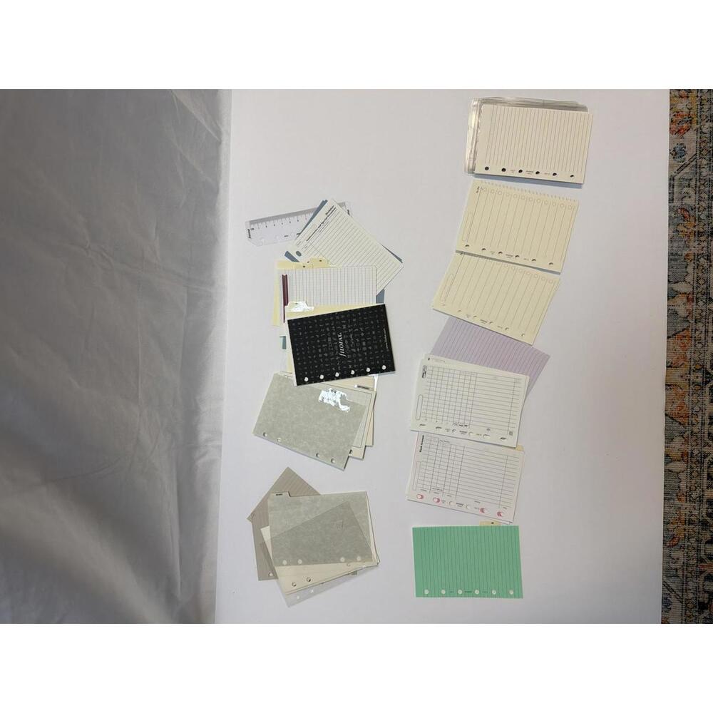 Random assortment of pocket sized Filofax inserts